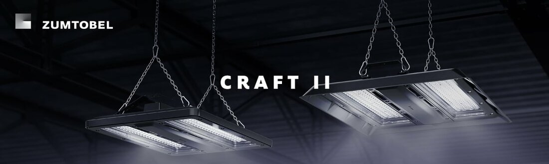 Abbildung von zwei hängenden CRAFT II Leuchten in dunkler Industriehalle. | © Zumtobel